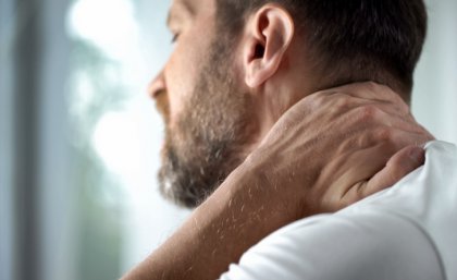 Man holding his neck in pain